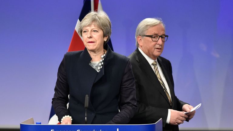 British Prime Minister Theresa May (L) and European Commission chief Jean-Claude Juncker give a press conference as they meet for Brexit negotiations on December 4, 2017 at the European Commission in Brussels. 