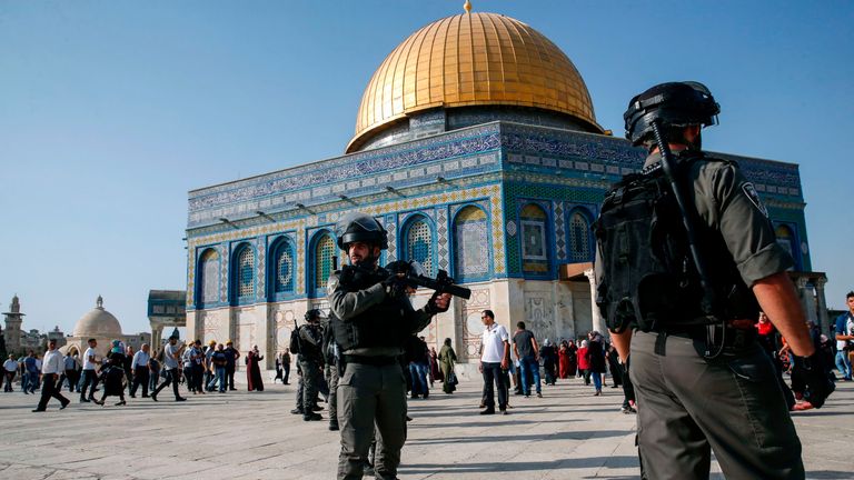 PALESTINIAN-ISRAEL-CONFLICT-JERUSALEM
Israeli security forces hold position as they stand guard in front of the Dome of the Rock in the Haram al-Sharif compound in the old city of Jerusalem on July 27, 2017. Clashes erupted between Israeli police and Palestinians at the sensitive Jerusalem holy site on July 27, 2017 as thousands of Muslim worshippers entered to end a boycott of the compound over new Israeli security measures. The Palestinian Red Crescent reported 46 people wounded both inside th