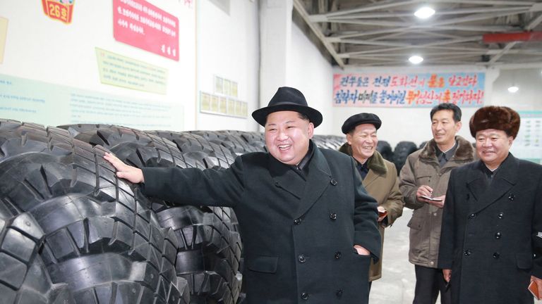 Kim Jong Un inspects tyres at a factory which were used for missile truck