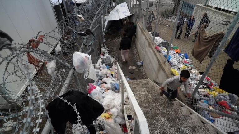 Rubbish is piled high across the camp