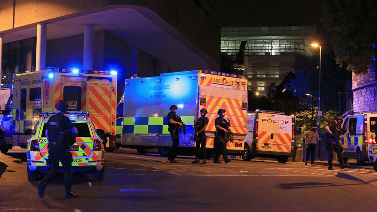 Armed police at Manchester Arena after reports of an explosion at the venue during an Ariana Grande gig.