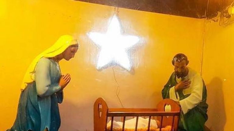 The crib scene which the church puts up each year to encourage donations