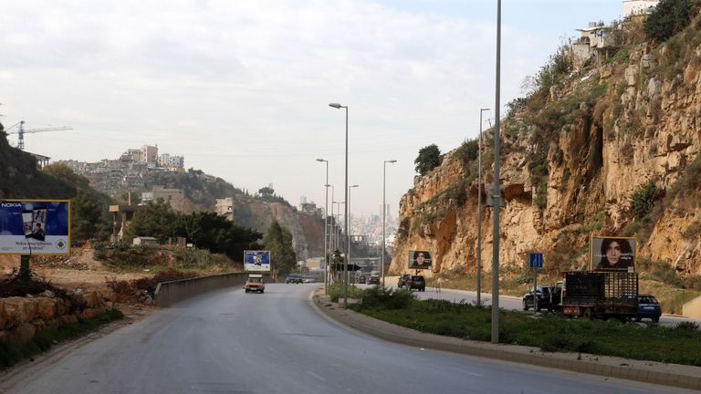 Cars pass near the area where Ms Dykes&#39; body is believed to have been found outside Beirut
