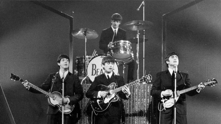 The Beatles on stage at the London Palladium in front of 2, 000 screaming fans