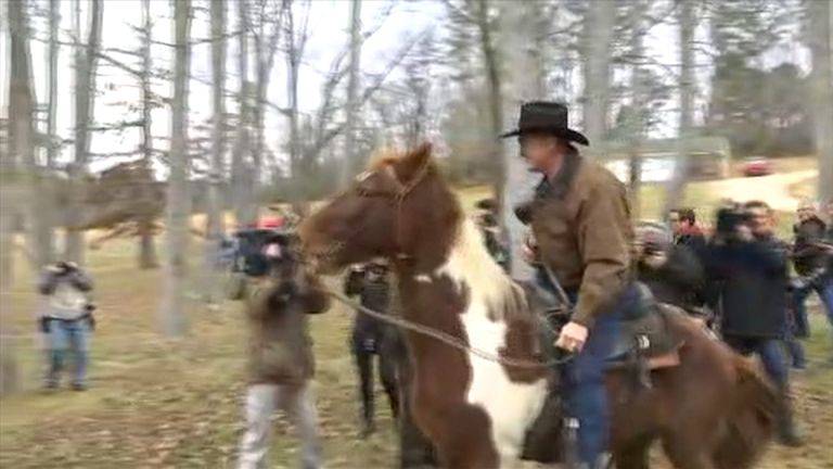 Roy Moore leaves the polling booth on horseback
