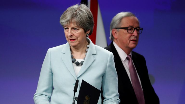 Theresa May and European Commission President Jean-Claude Juncker hold a news conference at the EC headquarters in Brussels