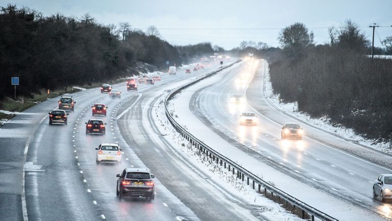 Snow reduces the M5 motorway down to two lanes between junction 14 and 15 in South Gloucestershire