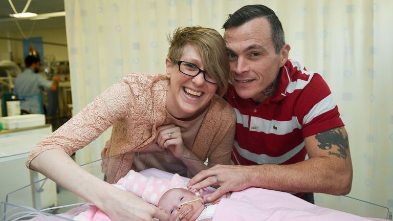 Three-week-old Vanellope Hope Wilkins with her delighted parents