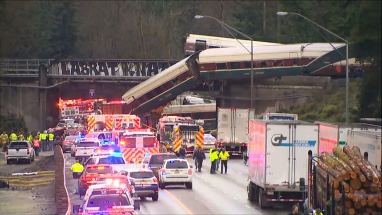 Amtrak carriages fell onto the highway below during the train&#39;s first journey on a new track.