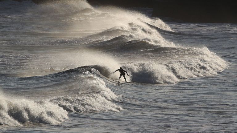 The freezing conditions did not put off this surfer in the North Sea at Tynemouth