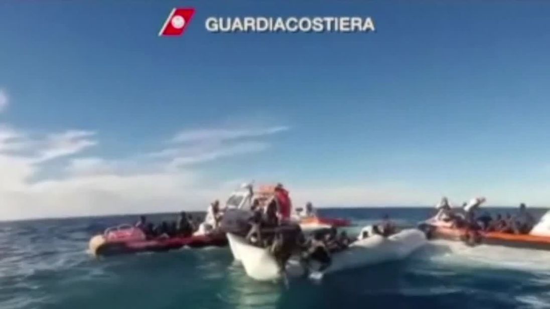 Footage shows dramatic rescue of migrants off Libyan coast.