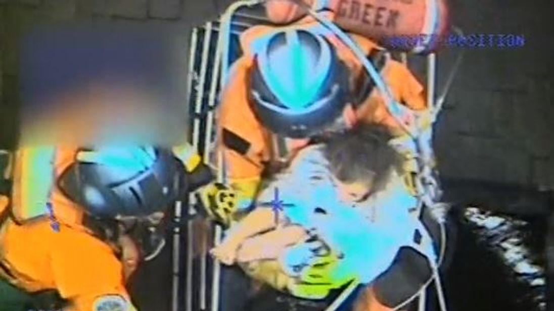 A Coast Guard MH-60T Jayhawk helicopter crew from Coast Guard Sector San Diego rescues a family of five, including a newborn, seven-year-old son, three-year-old daughter and two dogs, in Santa Barbara County, California after a mudslide, Jan. 9, 2018. Pic: US Coast Guard