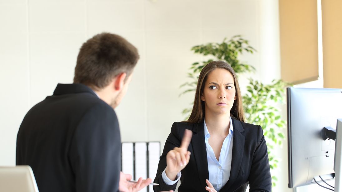A female employee telling her male colleague something is not acceptable