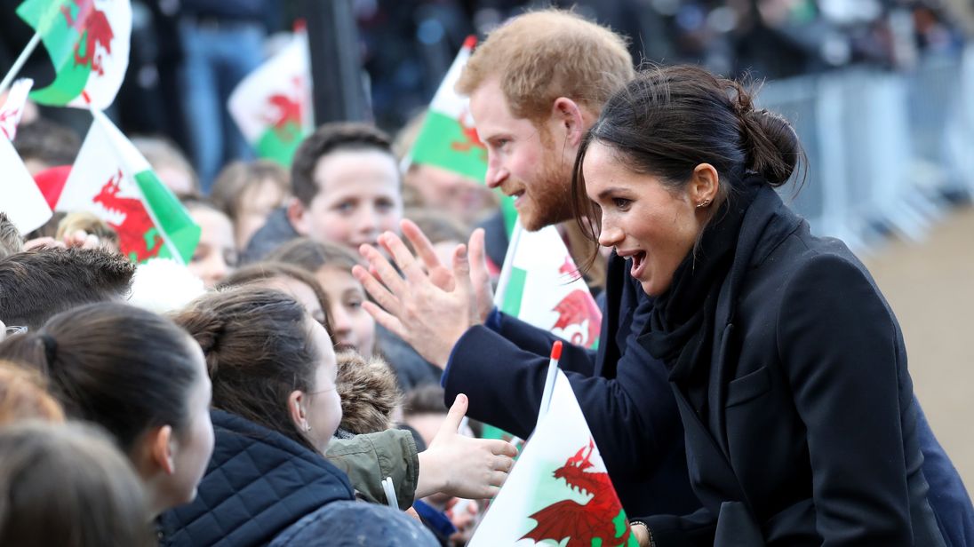 Prince Harry and his fiancee Meghan Markle are seen during a walkabout at Cardiff Castle