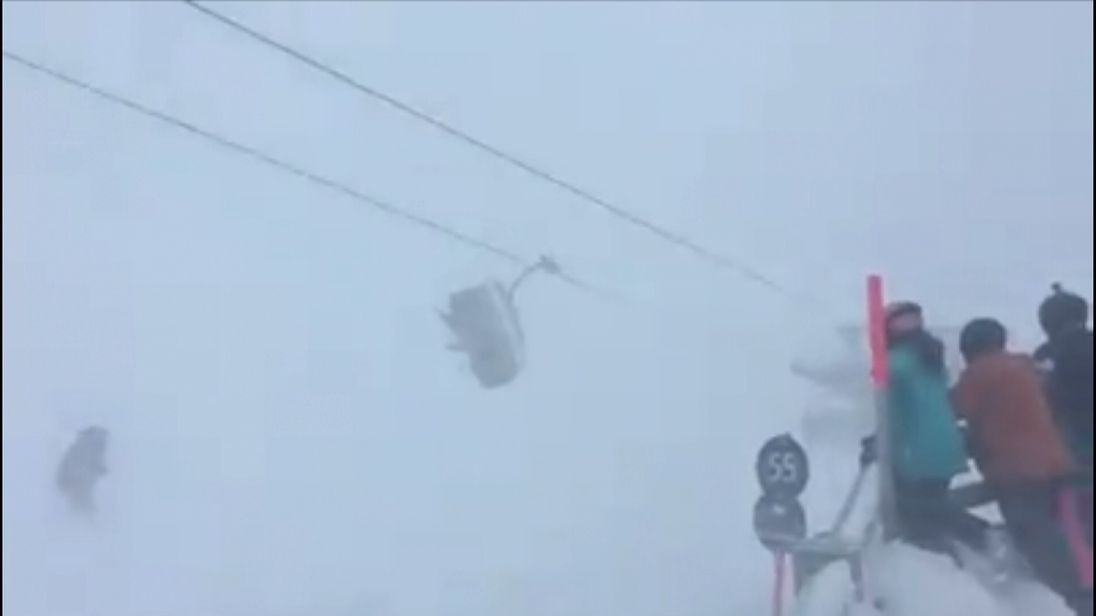 Skiers swing wildly on lift during storm at Austria resort