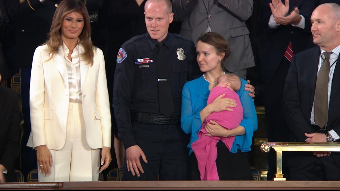 Officer Ryan Holets and wife Rebecca adopted the baby of a heroin addict