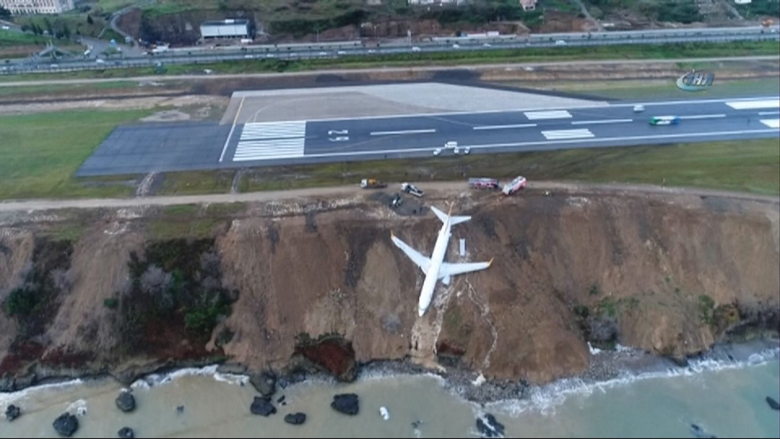 Plane skids off runway and gets stuck in mud on cliff edge in Turkey