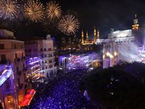 Fireworks explode over downtown Beirut, Lebanon, during New Year's celebrations, on January 1, 2018