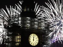 Fireworks explode over Big Ben and Parliament as thousands gather to ring in the near year on January 1, 2018 in London, England
