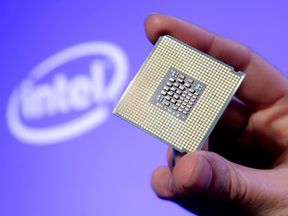 SAN FRANCISCO, CA - JUNE 26: In this handout photo provided by Intel, Tom Kilroy, vice president of Intel?s Digital Enterprise Group, displays Intel&#39;s new Dual-Core Xeon Processor 5100 on June 26, 2006 at an event in San Francisco. Available for high-volume servers, workstation and communications markets, the 64-bit processor is based on the Intel Core Microarchitecture for increased performance with reduced energy consumption. (Photo by Court Mast/Intel via Getty Images)
