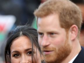 Prince Harry and his fiancee Meghan Markle are seen during a walkabout at Cardiff Castle