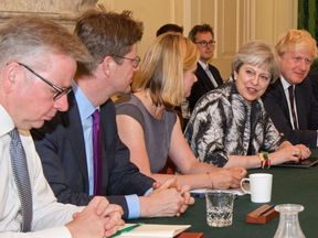 The PM is expected to announce Cabinet changes on Monday as she seeks to balance the Tories&#39; pro-Brexit and Remain factions.