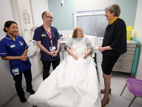 Mrs May spoke to patients and staff on a visit to Frimley Park Hospital in Surrey