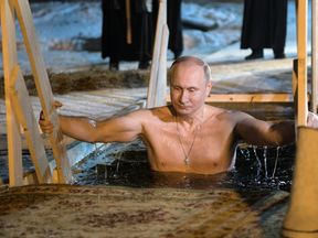 Russian President Vladimir Putin takes a dip in the water during Orthodox Epiphany celebrations at lake Seliger, Tver region, Russia 