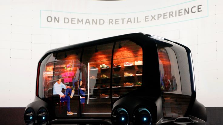 Toyota displays the "e-Pallete", a new fully self-driving electric concept vehicle designed to be used for ride hailing, parcel delivery services and other uses 