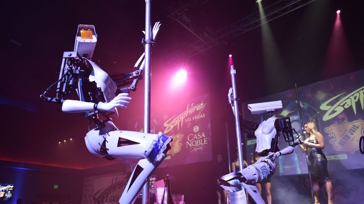 Stripper robots perform at the Sapphire Gentlemen&#39;s Club on the sidelines of CES 2018 in Las Vegas on January 8, 2018. / AFP PHOTO / Mandel Ngan (Photo credit should read MANDEL NGAN/AFP/Getty Images)