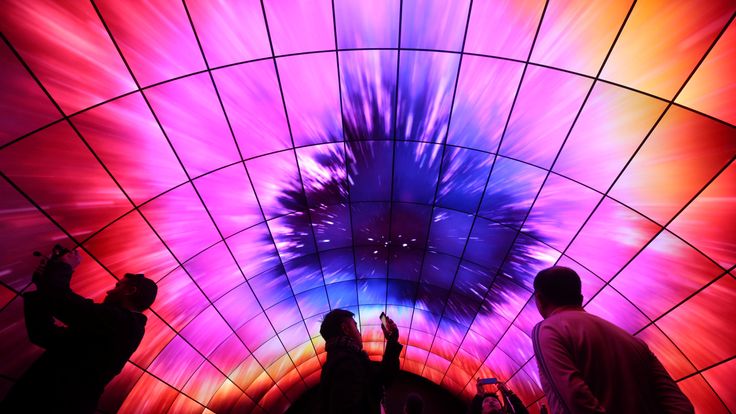 Attendees view video on a tunnel of LG OLED televisions during the 2017 CES in Las Vegas, Nevada, U.S., January 5, 2017