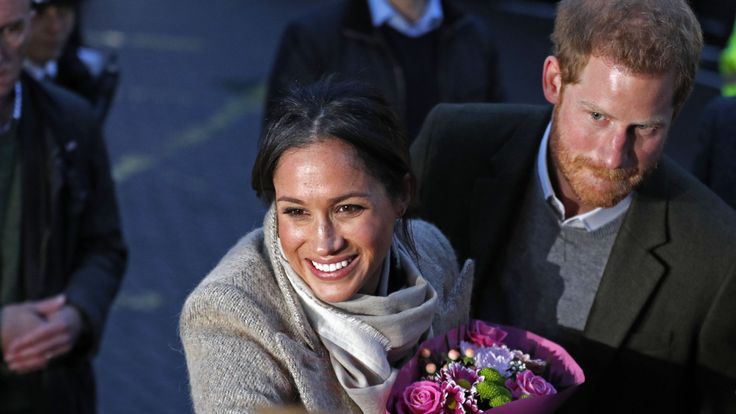 Prince Harry and his fiancée Meghan Markle meeting well-wishers as they leave Brixton