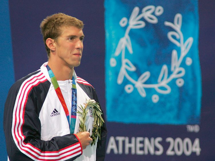 Michael Phelps wins gold at his first Olympic Games in Athens in 2004