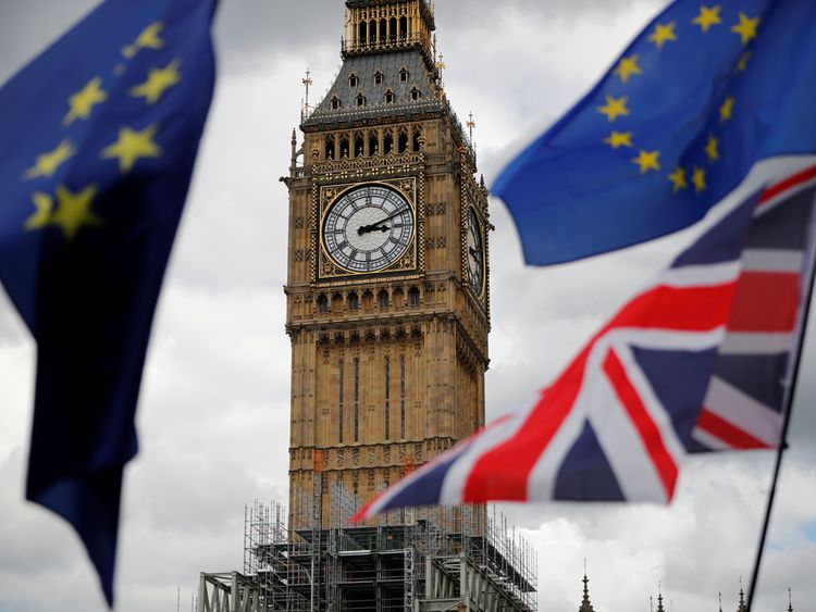 The Union Flag and European Union flags fly near the Elizabeth Tower, during the anti-Brexit 'People's March for Europe'