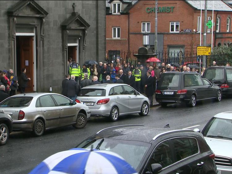 Fans gathered outside as the hearse arrives