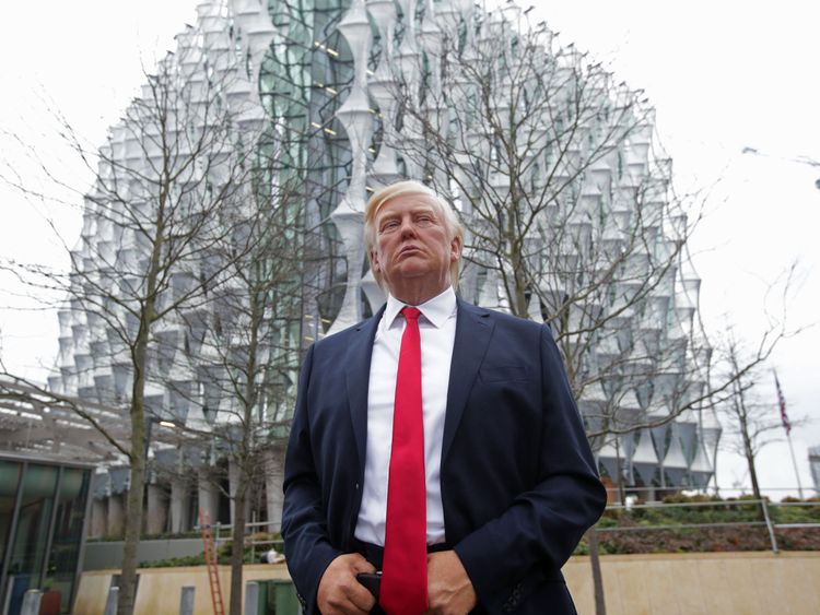 The Madame Tussauds wax figure of US President Donald Trump outside the new US Embassy in Nine Elms, London, after Mr Trump confirmed he will not travel to the UK to open the new building - and hit out at the location of the 1.2 billion dollar (�886 million) project.