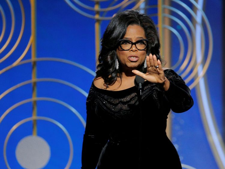 Oprah Winfrey collects her lifetime achievement award