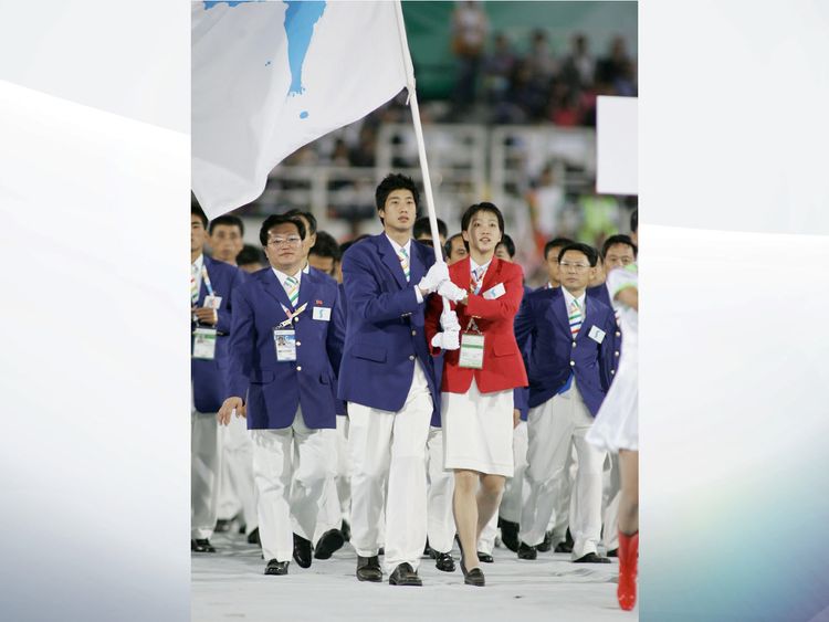 The teams march under one flag at the East Asian Games in 2005