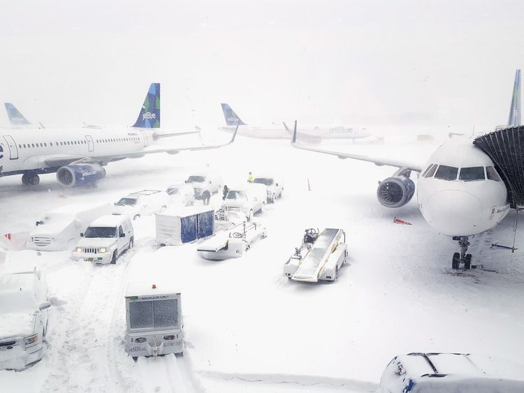 JetBlue airplanes wait at the gates outside terminal five at John F. Kennedy International Airport on January 4, 2018 in the Queens borough of New York City