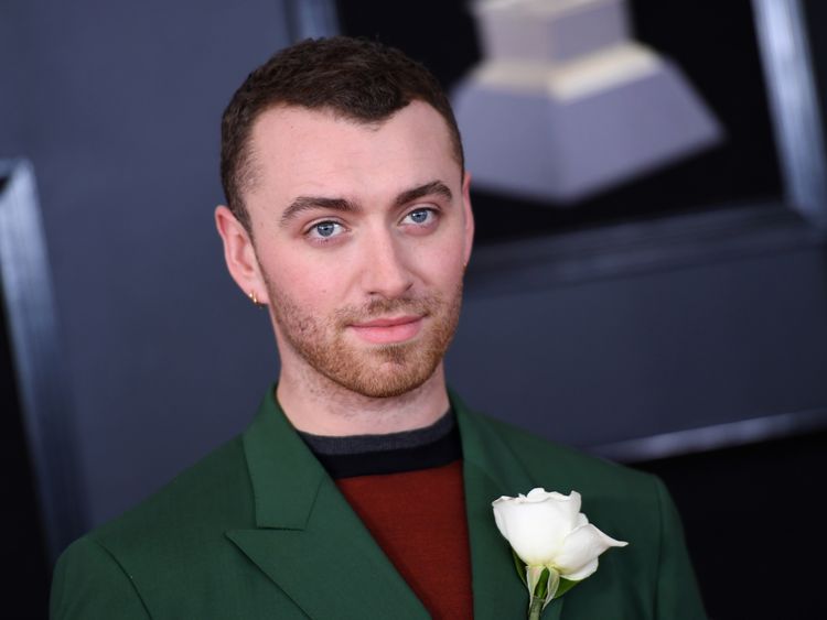 Sam Smith with a white rose in his lapel