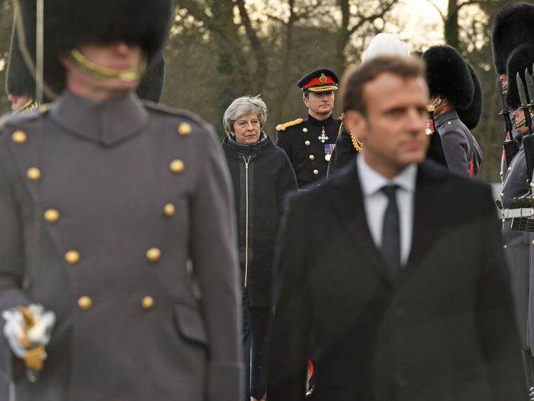 Theresa May and Emmanuel Macron view a guard of honour at the Royal Military Academy Sandhurst