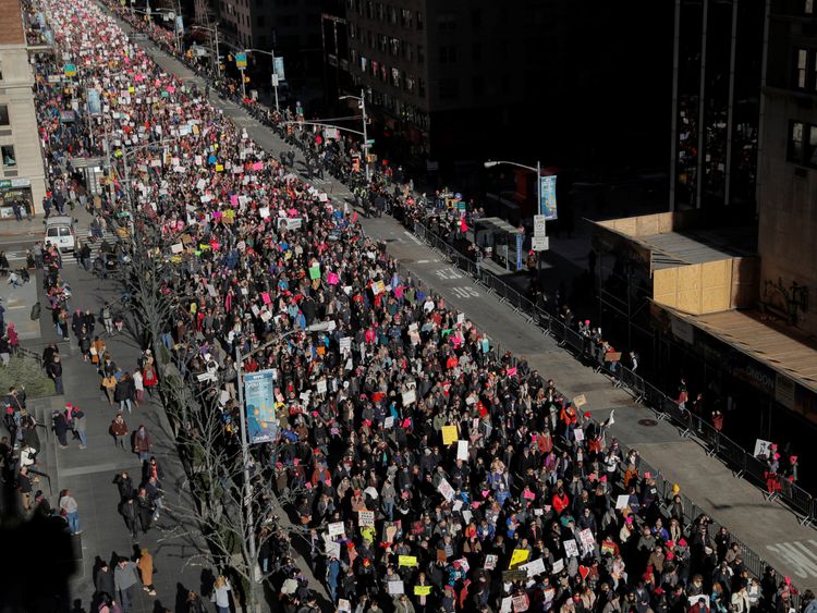People walk down Sixth Avenue as they participate in the Women's March in Manhattan, New York City, New York, U.S., January 20, 2018. REUTERS/Andrew Kell