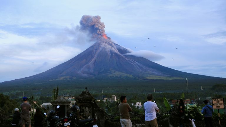 Residents watching Mount Mayon erupt on Thursday