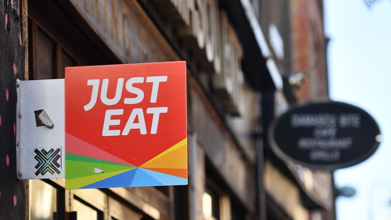 A sign for Just Eat, a food delivery service can be seen above a restaurant in London on December 18, 2017...Just Eat has been welcomed on December 18, 2017 into UK&#39;s FTSE 100 index of the country&#39;s largest publicly listed companies.  / AFP PHOTO / BEN STANSALL        (Photo credit should read BEN STANSALL/AFP/Getty Images)
