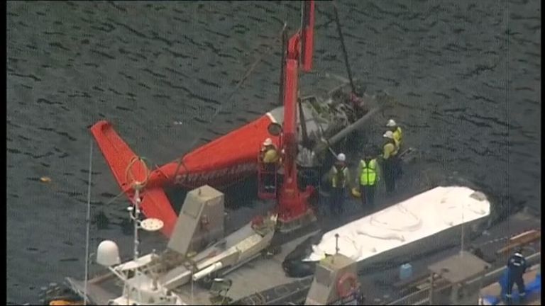 The seaplane is lifted from the water