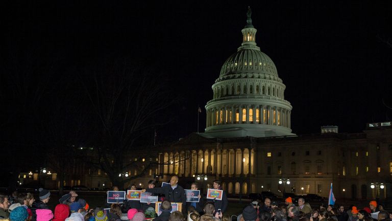 Protesters outside the Capitol building as the US Government shuts down
