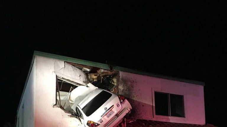 Car flies into the air and becomes wedged in dental office in