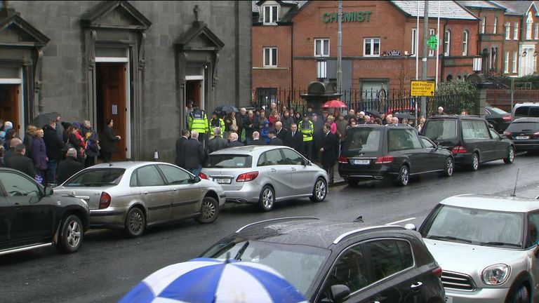 Fans gathered outside as the hearse arrives