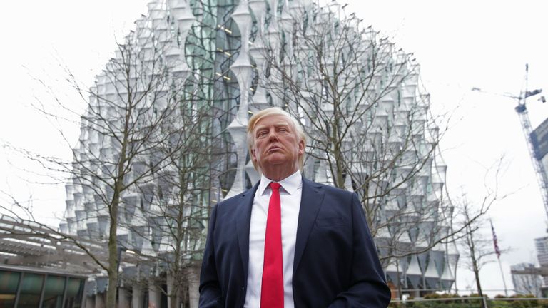 The Madame Tussauds wax figure of US President Donald Trump outside the new US Embassy in Nine Elms, London, after Mr Trump confirmed he will not travel to the UK to open the new building - and hit out at the location of the 1.2 billion dollar (�886 million) project.