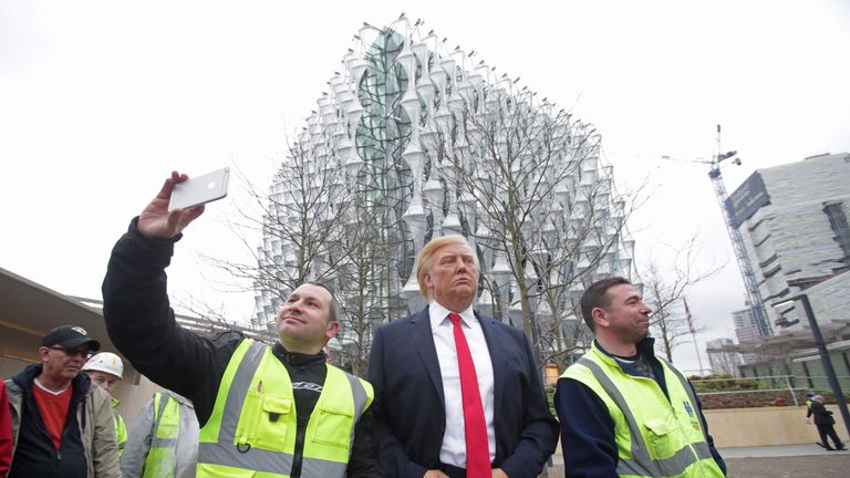 The Madame Tussauds wax figure of US President Donald Trump outside the new US Embassy in Nine Elms, London, after Mr Trump confirmed he will not travel to the UK to open the new building - and hit out at the location of the 1.2 billion dollar (�886 million) project.
